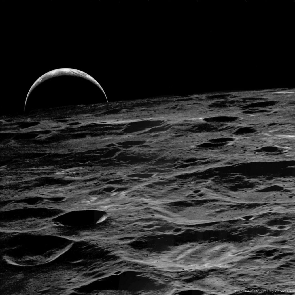 A crescent Earth rising over the Moon