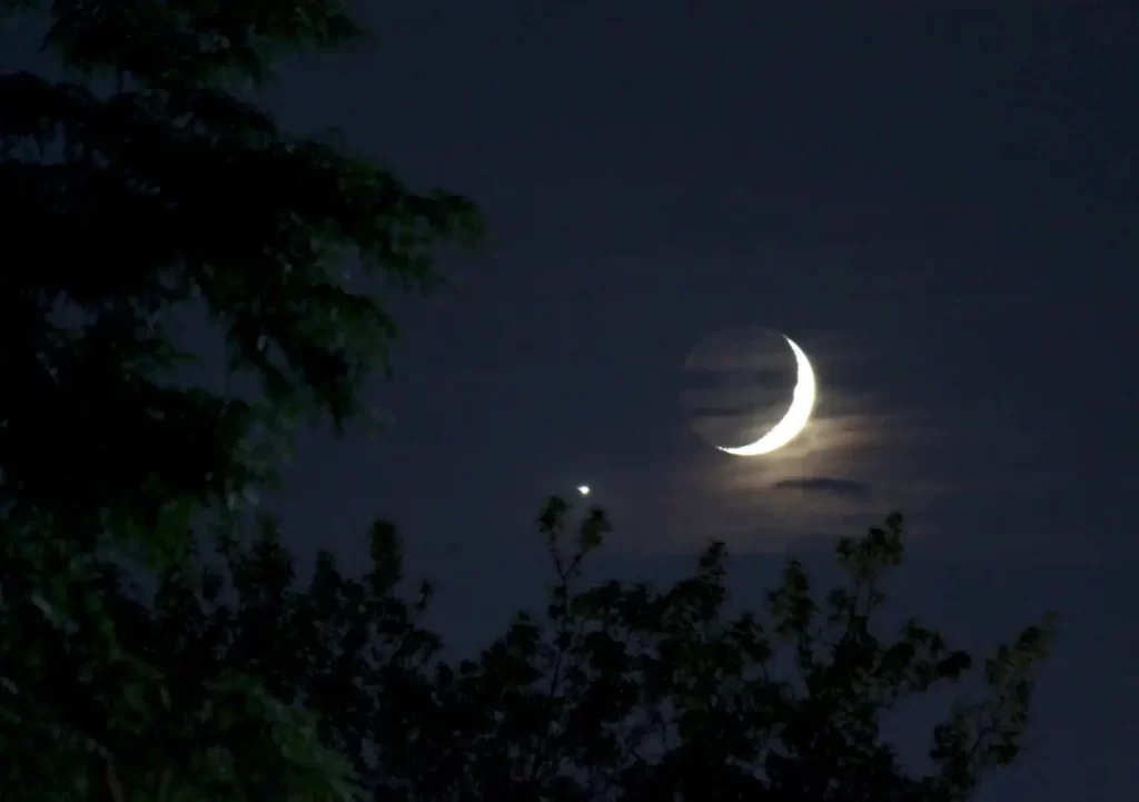 Bright Venus seen near the crescent Moon