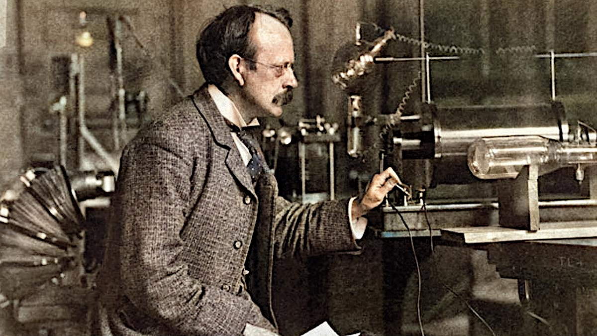 J. J. Thomson with his cathode-ray tube which he discovered electrons