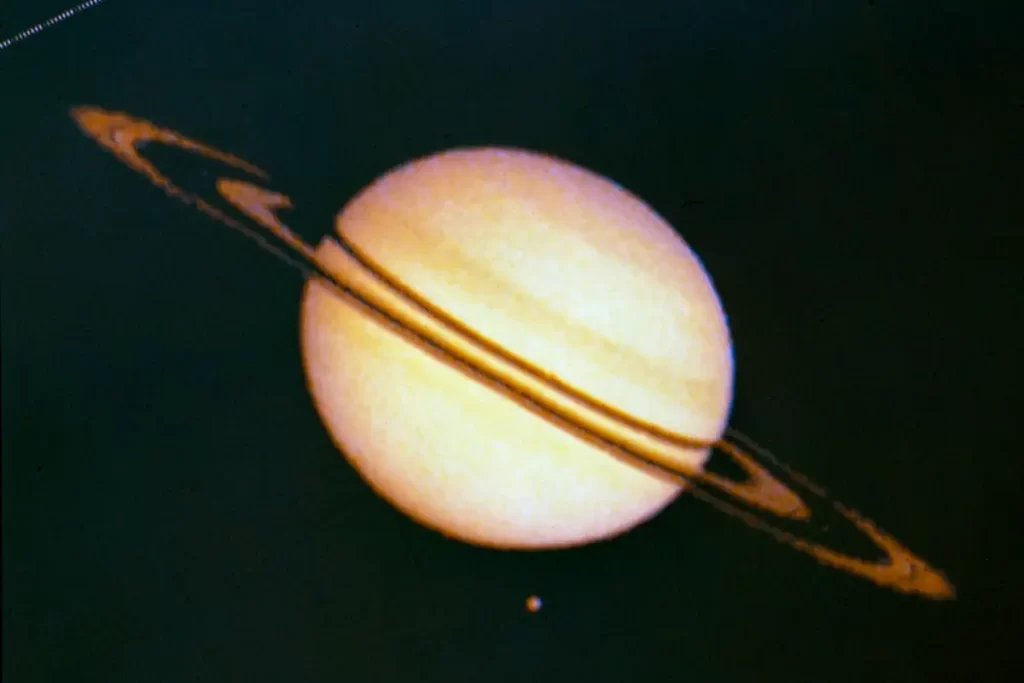 Pioneer 11 Image of Saturn and Its Moon Titan - the first Saturn flyby